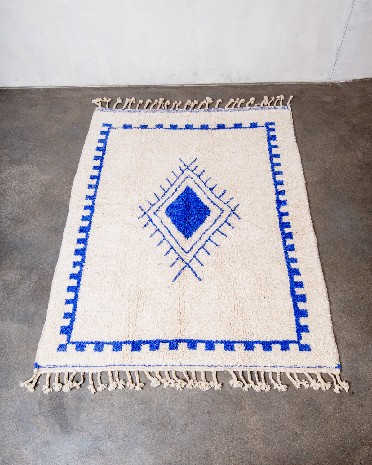 Modern, designer, handcrafted Berber rug from Morocco. Beniourain carpet with beautiful colours and patterns and fluffy wool texture.